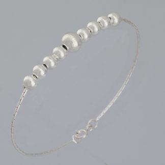 Pulsera cordón 9 bolas de 20,5 cm de longitud.