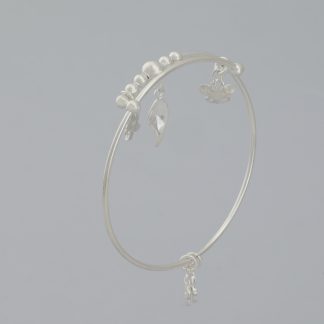 Brazalete tubo dijes de la suerte de Ø 6,2 cm .