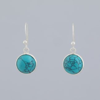 Pendientes ½ bola turquesa.